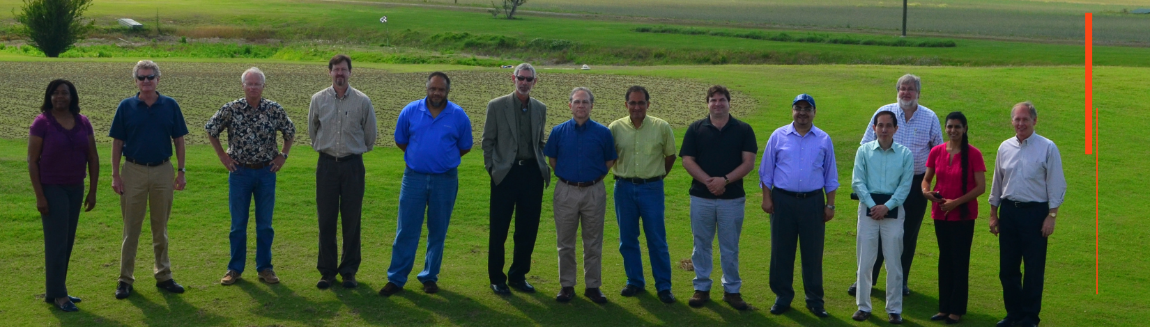 A photo of the CRS advisory board members in a field at UF.